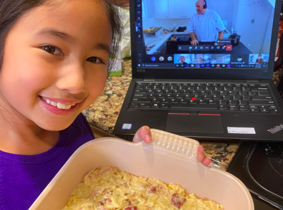 Taylor T. ‘28 with her Mac n Cheese while in the activity. 