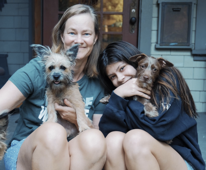 Orla I. 22 and Middle School History Teacher, Jennifer Irish, with their brand new puppies. 