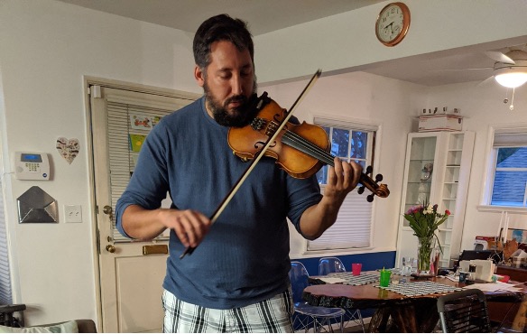 Mr. P. playing his violin.