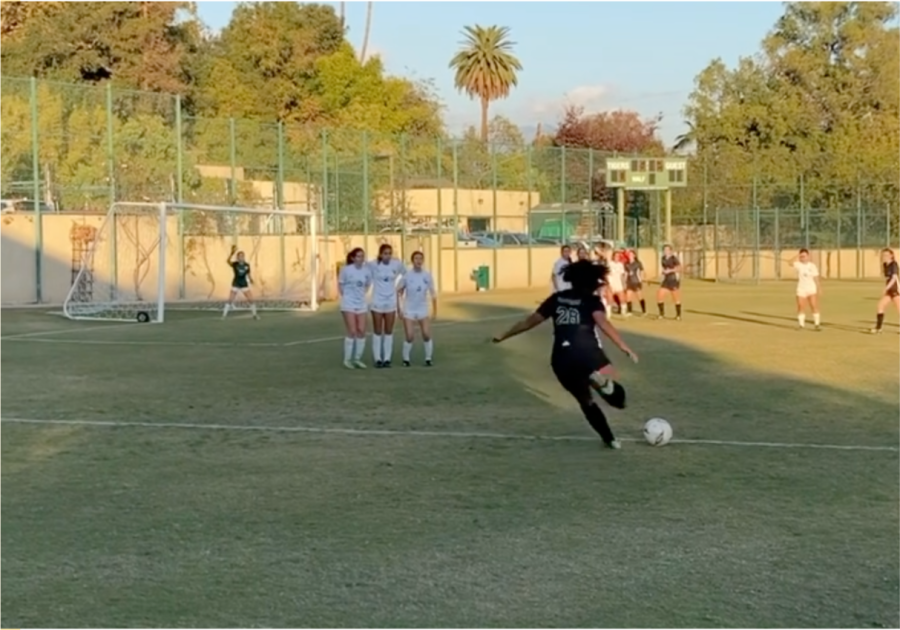 Gabby C. 23 scores a goal from a free kick against Temple City High School.