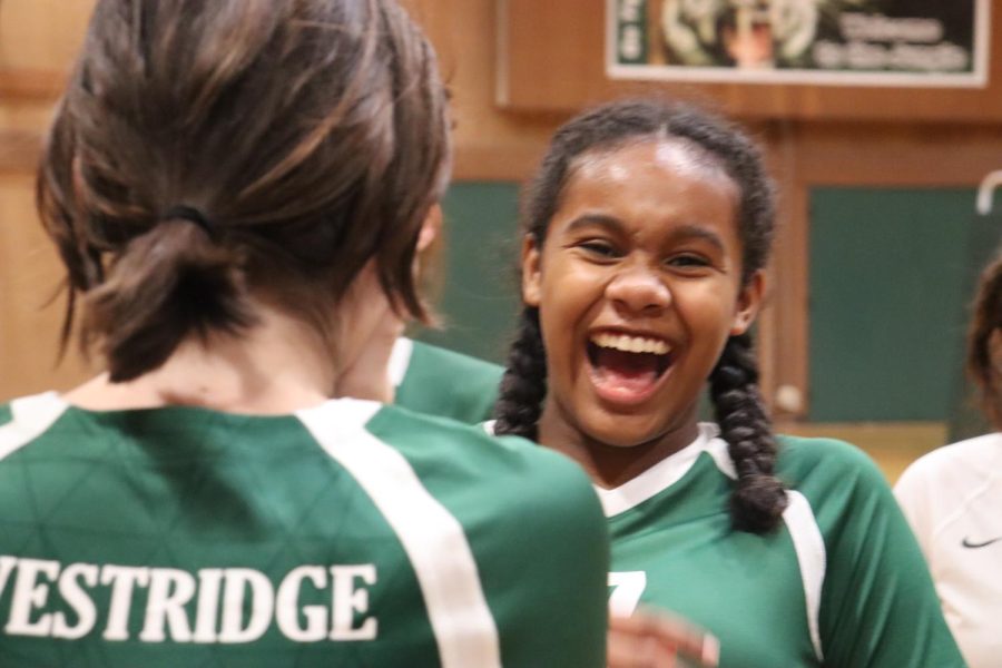 Freshman Micaela R. smiles after the Frosh volleyball team wins their first set of the year against Chadwick School.