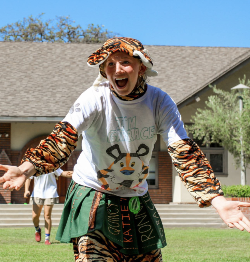 Grace N. ’23 wearing the Tiger mascot suit at a Westridge assembly. 