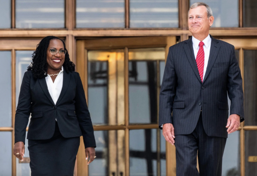 Justice Ketanji Brown Jackson and Chief Justice John Roberts walk out of the Supreme Court following her investiture ceremony.