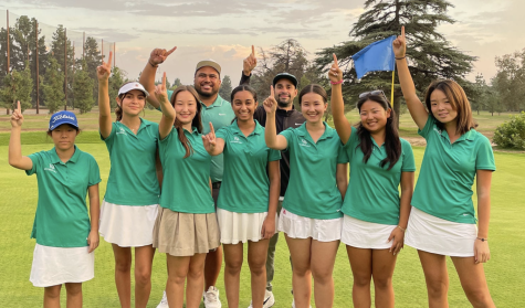 Varsity Golf poses for a photo after they were crowned league champions for the fourth straight season.