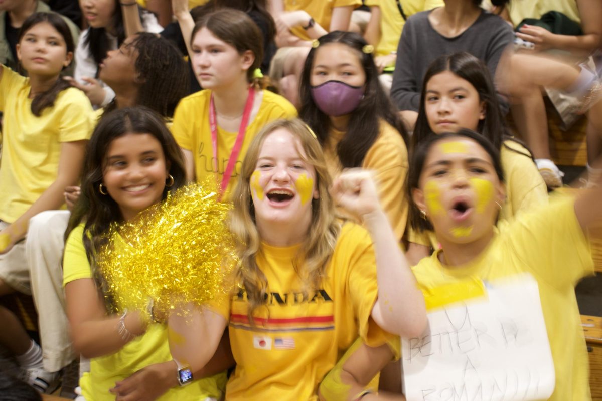 Roman middle school students sporting yellow and cheering for their team. Click the link below to read the photo essay.