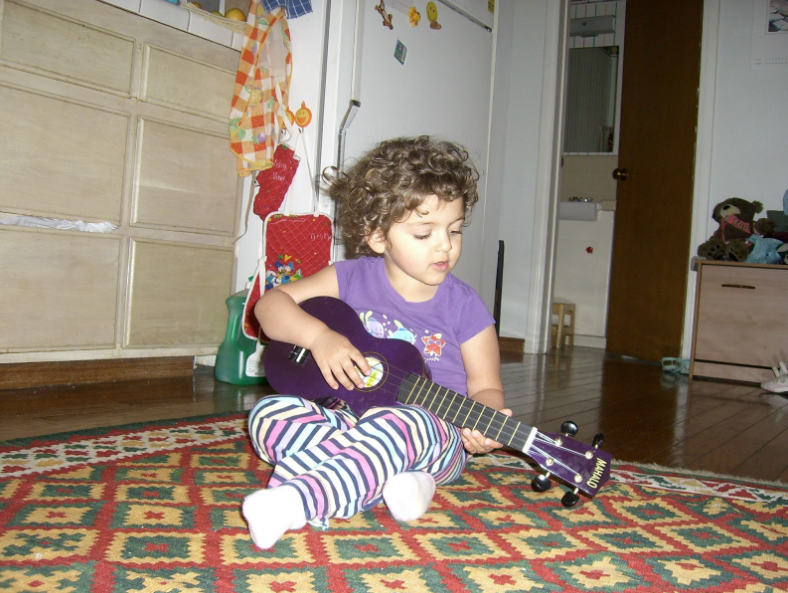 Singing and playing circa 2009 (3 years old)