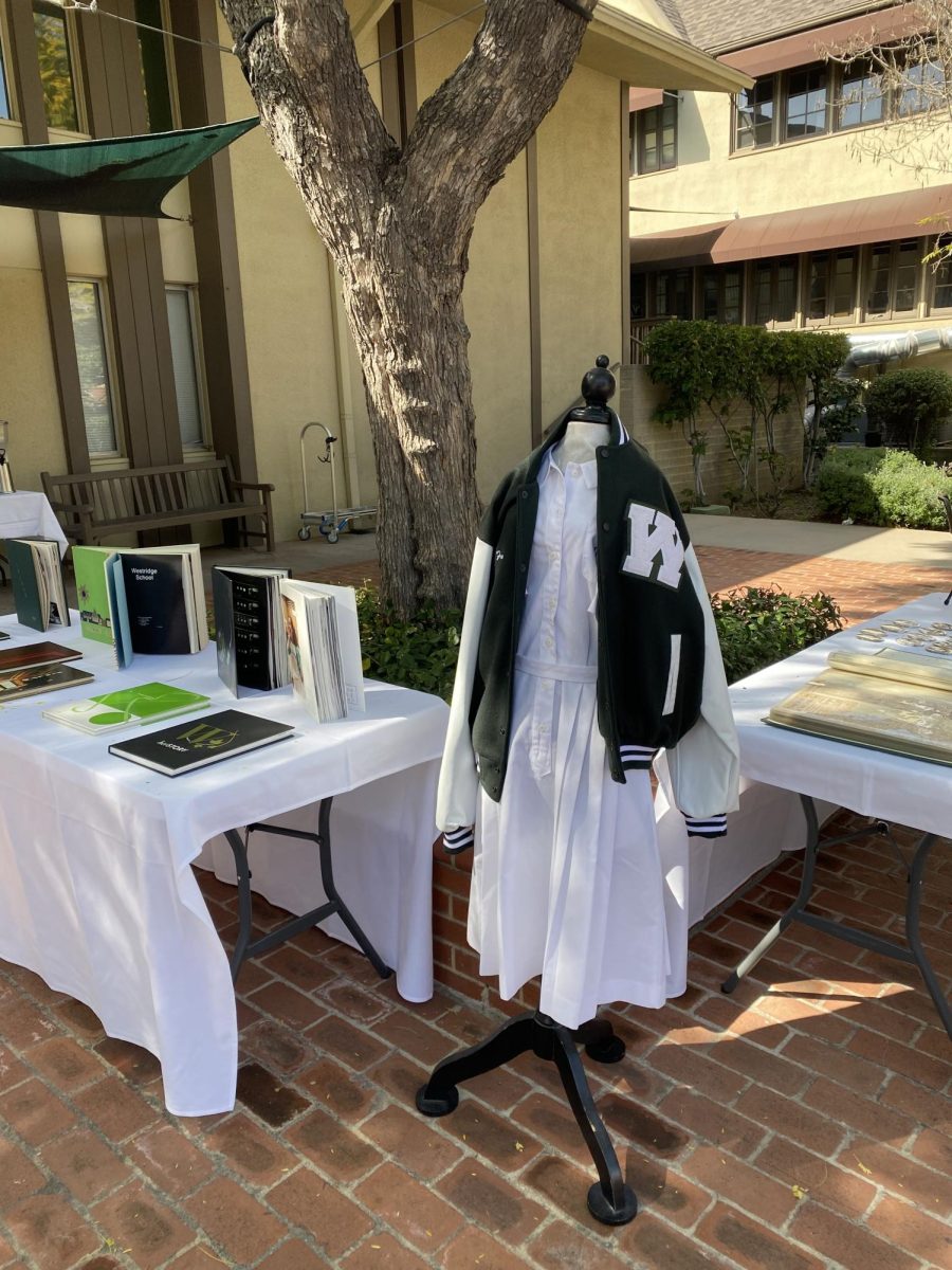 Commemorative tables of yearbooks and Westridge merchandise sparked interest and nostalgia during the event.