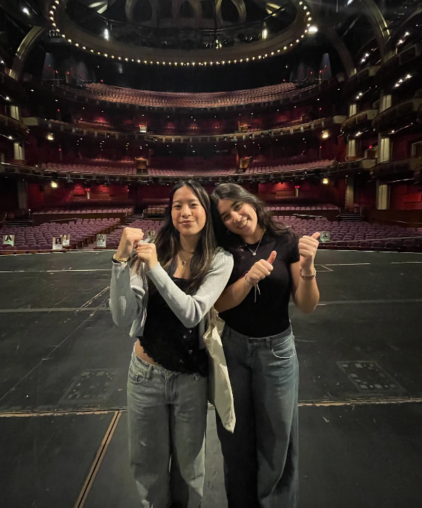 Shania W. '27 and Avin M. '27 Showing the Huge Stage at the Dolby Theater Tour 
