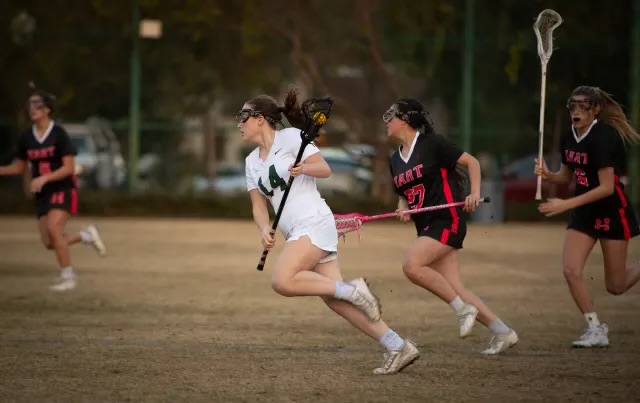 Sarah L. ’25, who reached scoring 100 goals earlier this year, playing in a lacrosse game