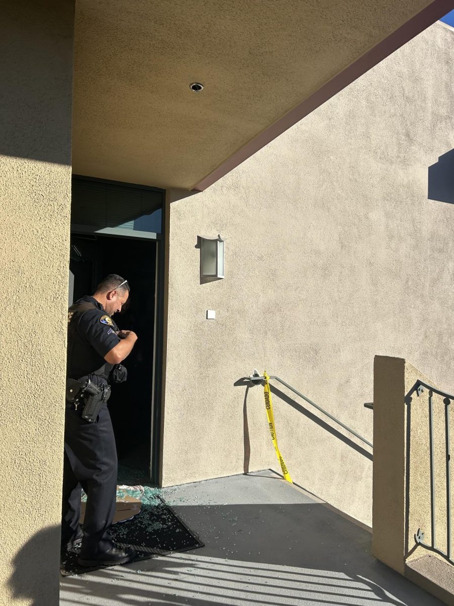 On Thursday, November 7, as students and faculty arrived at Westridge, they were met with an unexpected police presence. Pictured is the shattered glass door vandalized by the trespasser, alongside the police officer who responded to the scene.