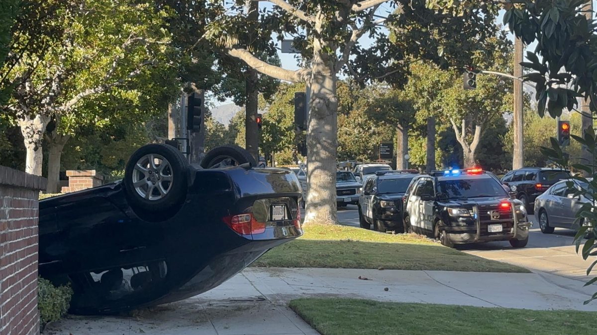 All eyes turned toward Orange Grove, where a car skidded out of control, flipped, and crashed.