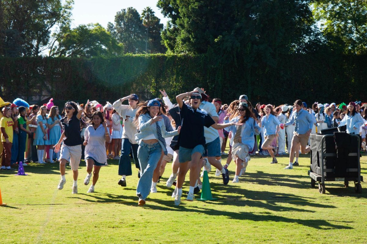 The Class of 2025 starts the Halloween parade, storming out in their gradewide "Frat Boys" costume.