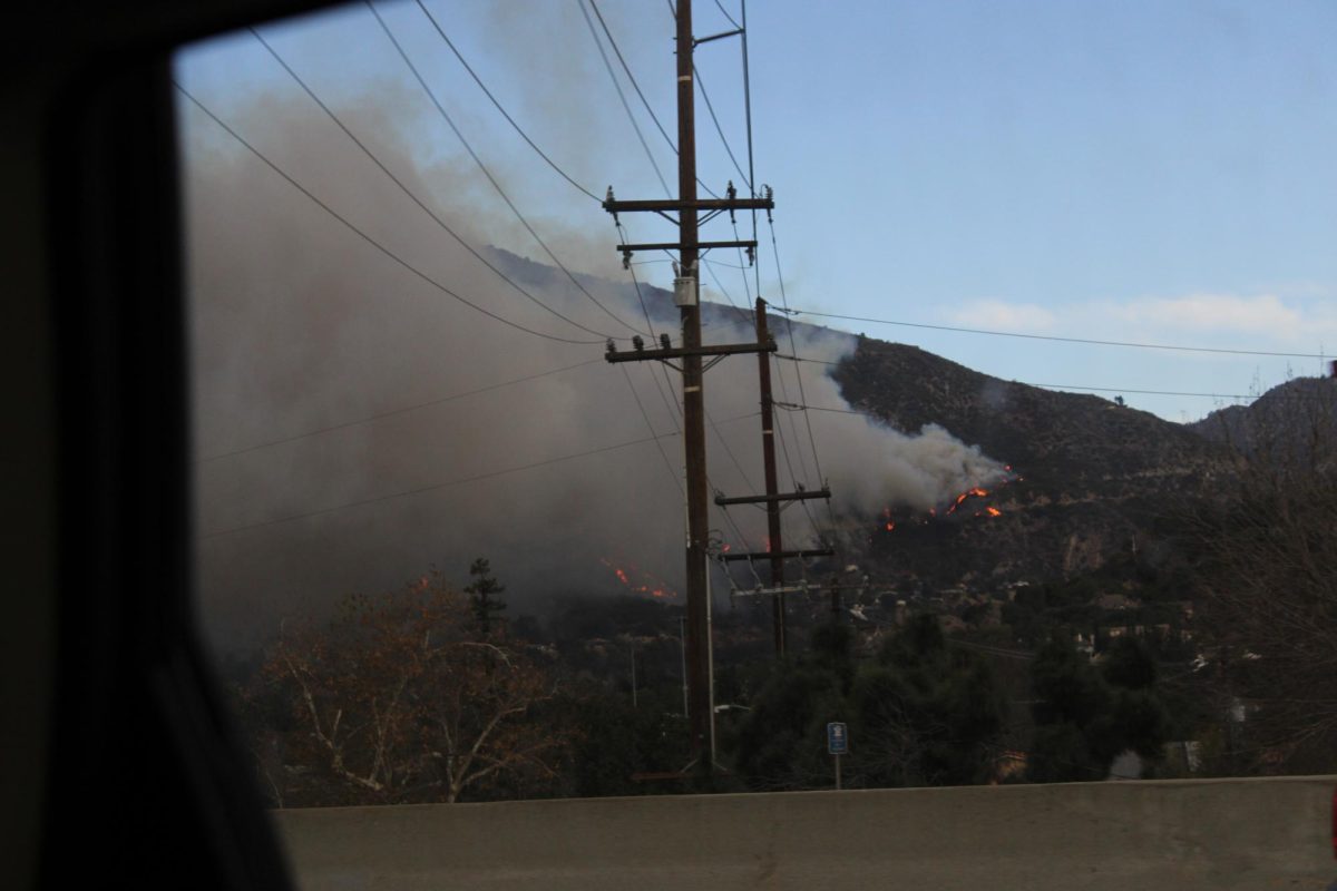 Smoke plumes from the Eaton Fire cloud the sky on Wednesday, Jan. 8, 2025 near the I-210 freeway.