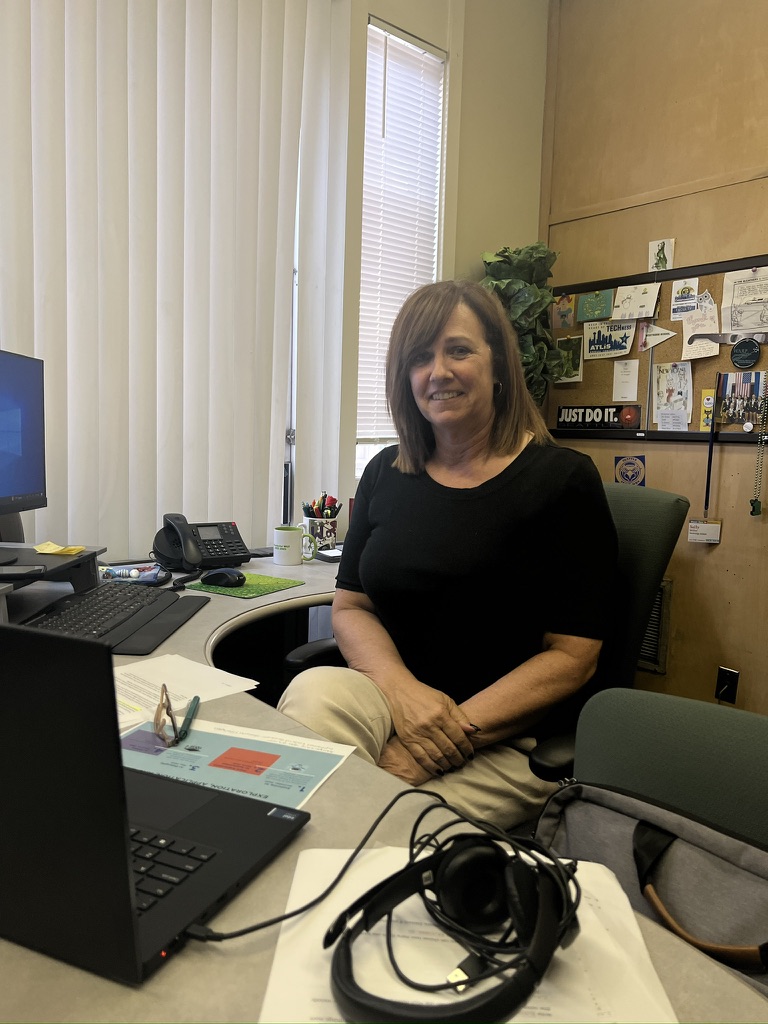 Director of Technology Ms. Sally Miller with one of the AI informational handouts she prepared for a faculty meeting.