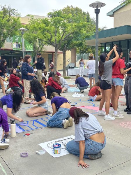 Seniors starting to stencil in their college emblems on Ayrshire Courtyard. 

