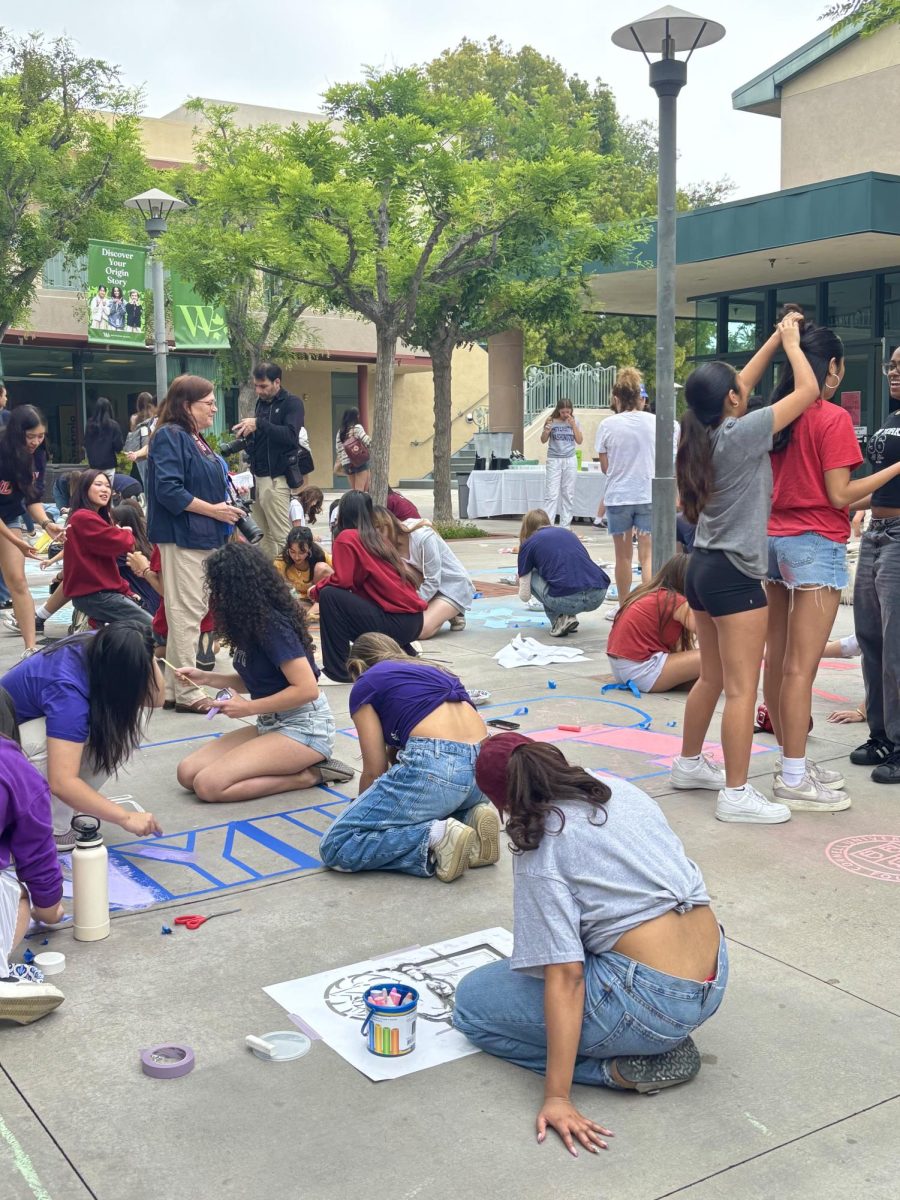 Seniors starting to stencil in their college emblems on Ayrshire Courtyard. 


