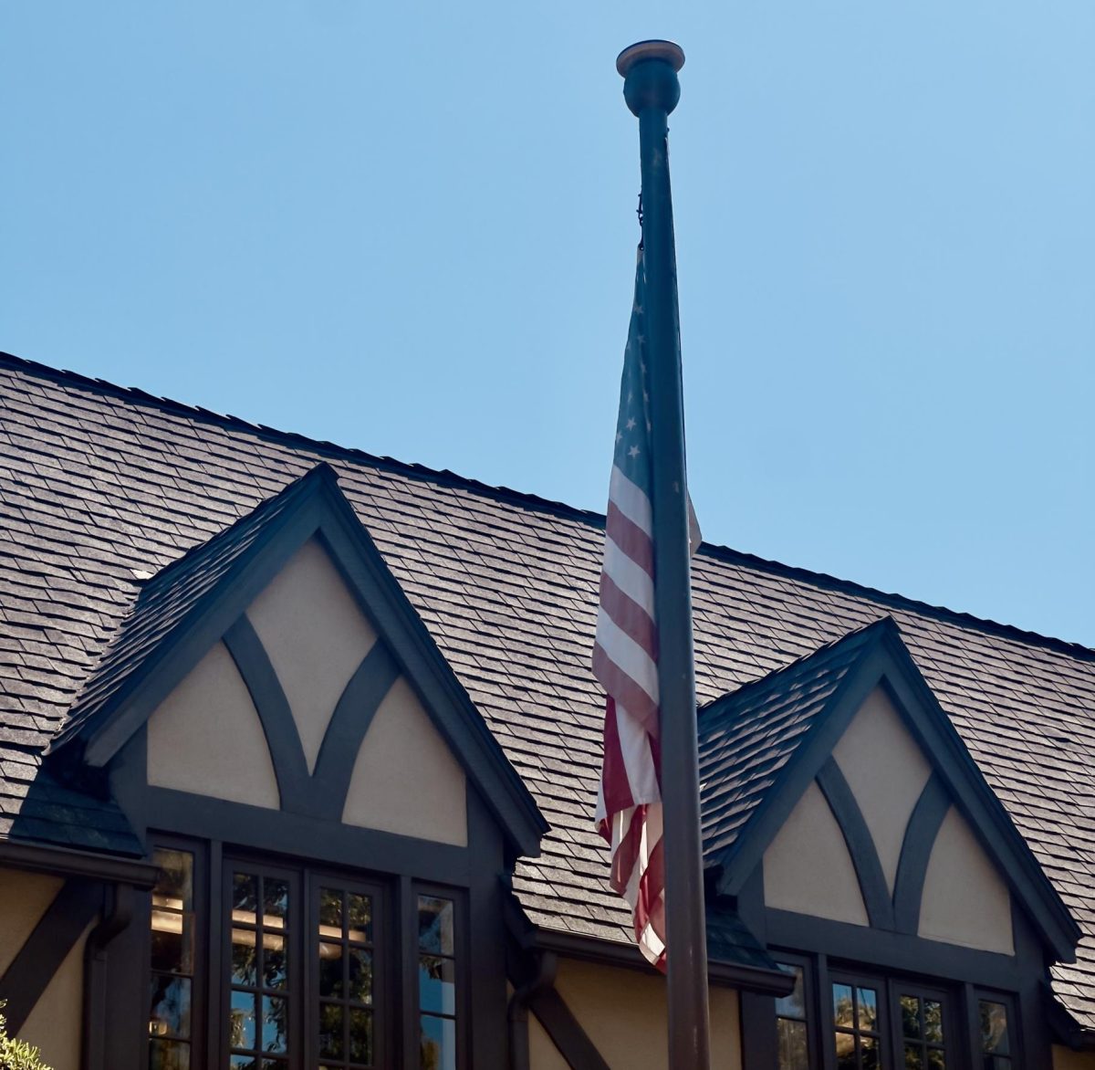 The American flag displayed in front of the Main Hall building. The Trump administration's stance on scientific research, immigration, and diversity, equity, and inclusion has directly affected and will likely continue to affect the Westridge community. 