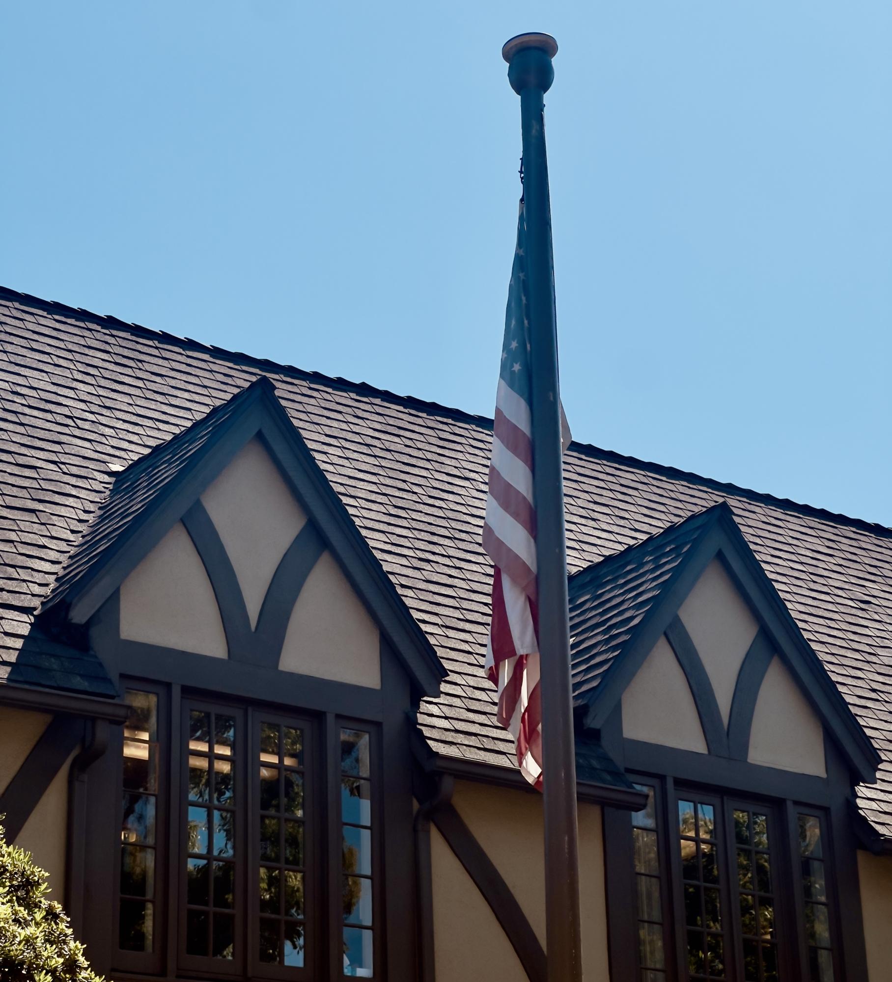 The American flag displayed in front of the Main Hall building. The Trump administration's stance on scientific research, immigration, and diversity, equity, and inclusion has directly affected and will likely continue to affect the Westridge community. 