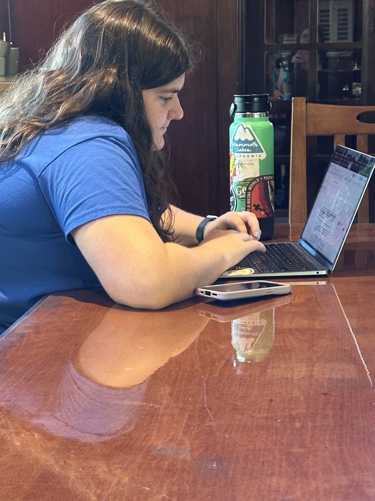Spyglass Editor-in-Chief Ella B. '25 hard at work trying to make a deadline.