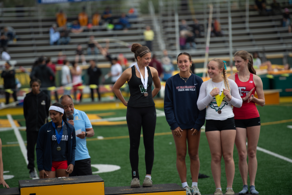 Teia L. ’26 stands at the podium at CIF-SS Finals after winning third place in the entire division in pole vault.

