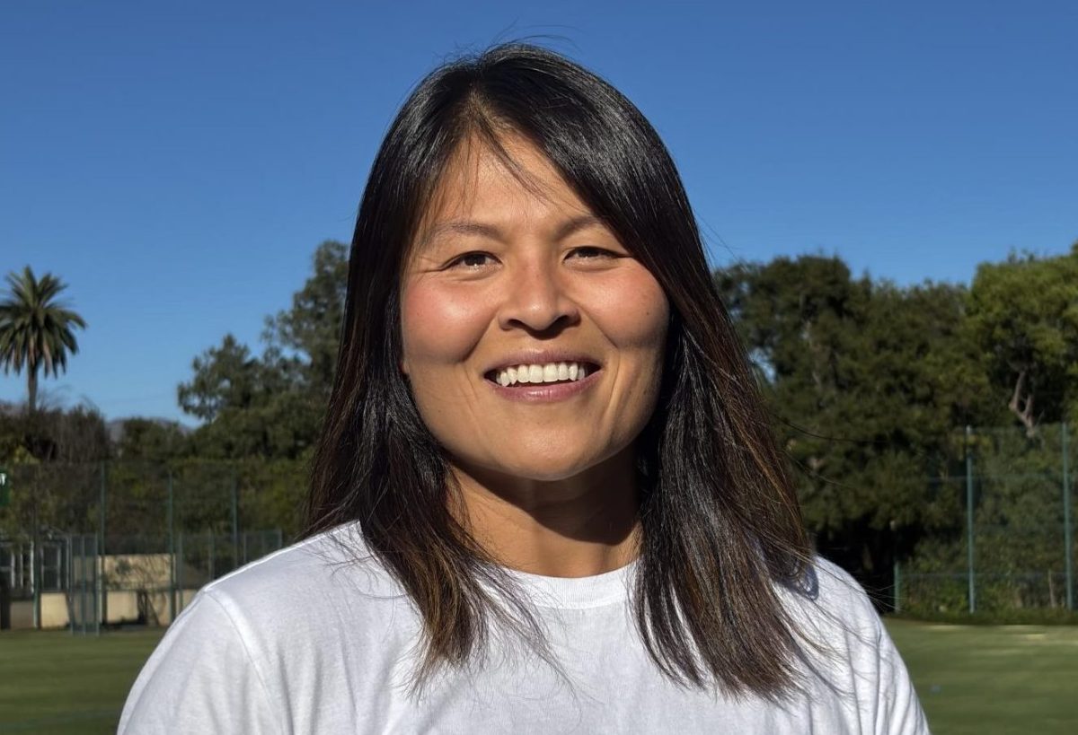 Coach Alice Lee showing her support at Flag Football’s White-Out game.
