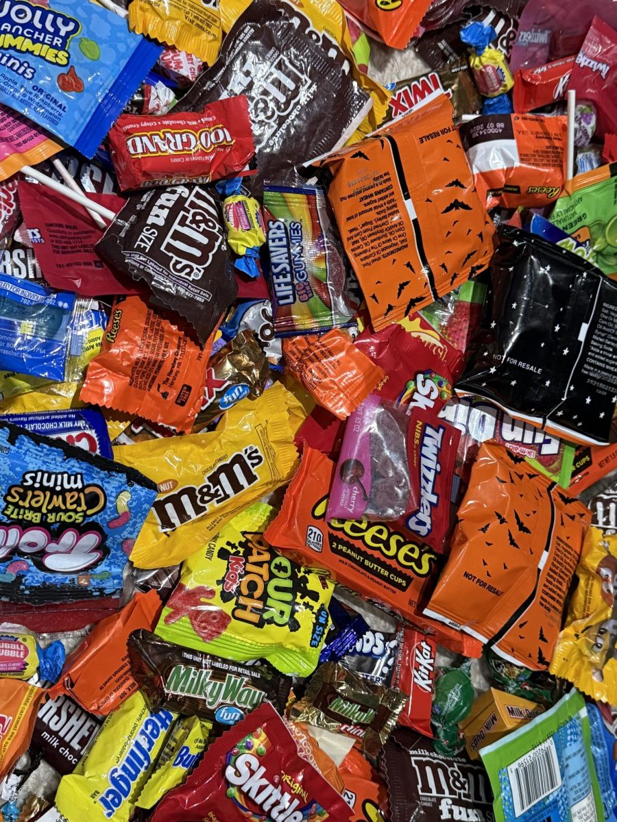Piles of Halloween candy highlight the waste that comes with the holiday, as plastic wrappers and uneaten candies often end up in landfills.