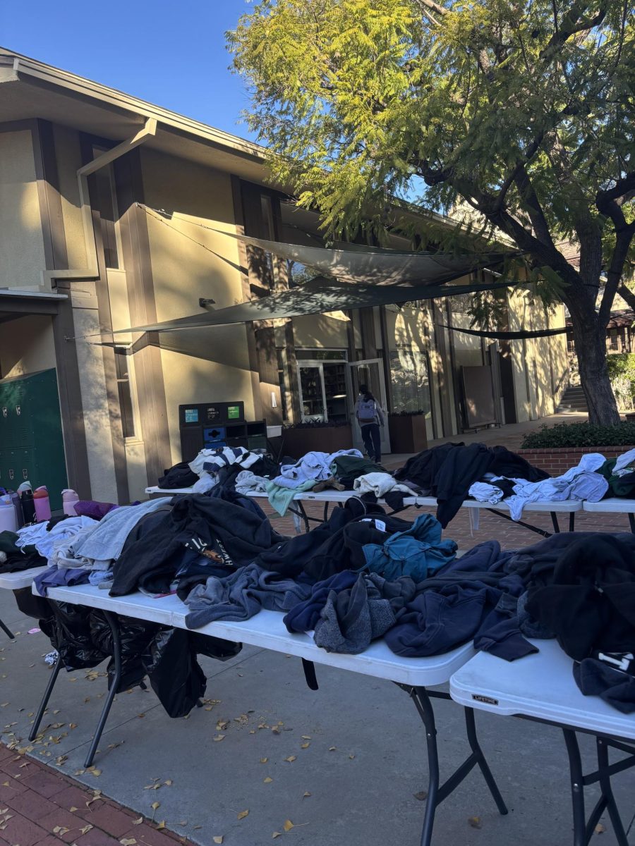 Piles of sweatshirts, hoodies, and shirts (mostly Westridge branded) lay on these tables stacked up until the owners reclaim them.