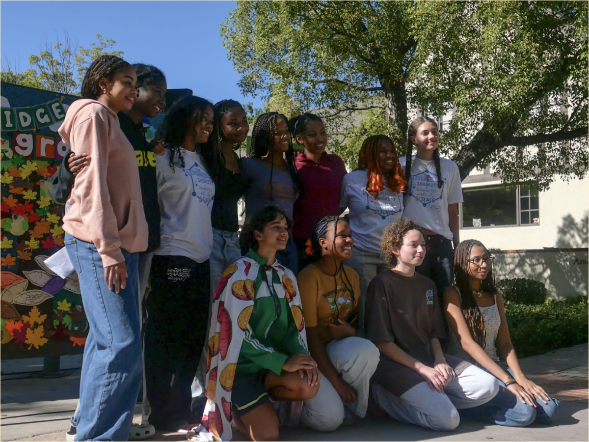 Students from the Black Student Union affinity at Yam Fest standing tall and proud as they talk more about the history of yams and its impact on their  heritage.