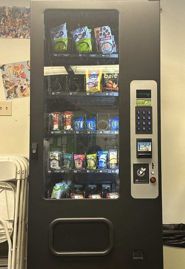The new vending machine stands, flaunting its diverse snack selection. But many do not know its perks. Read below to find out! 