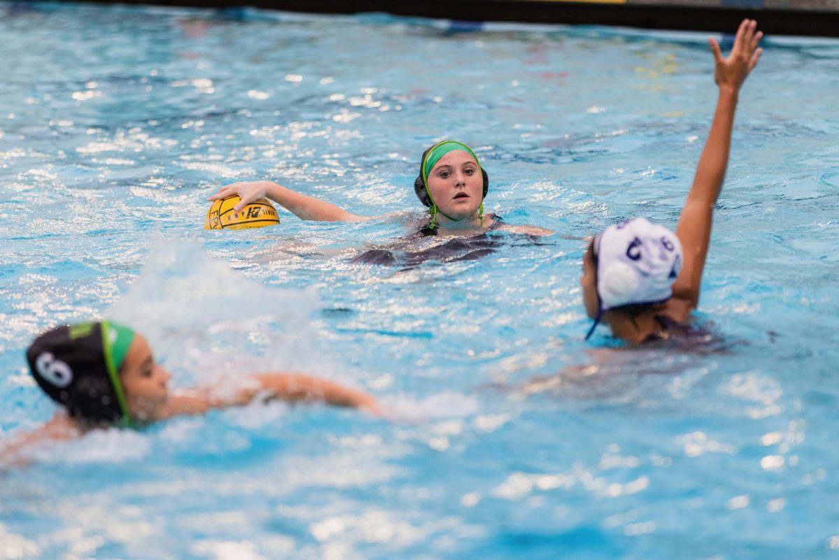 Sophomore Mira C. (center) looks for a pass in a game against Flintridge Prep.