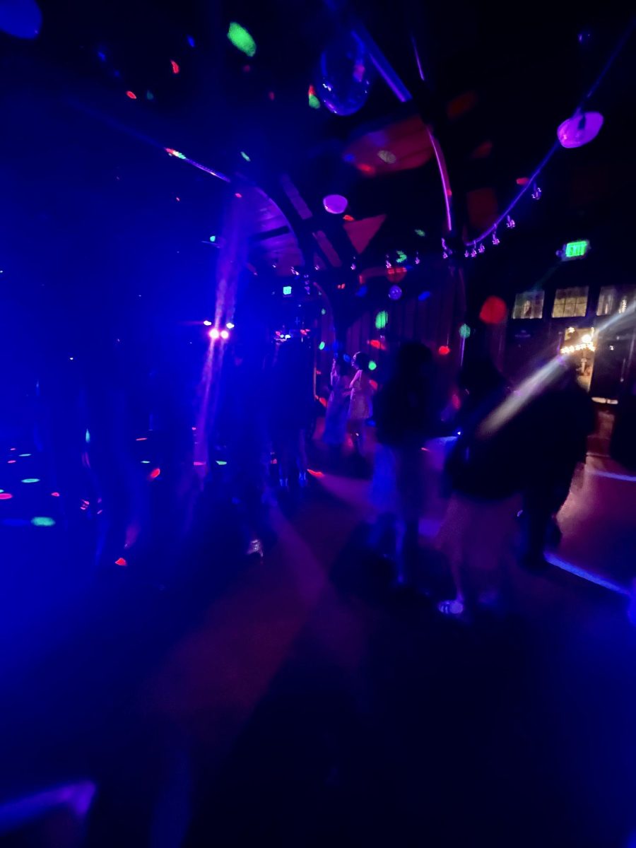 The Braun dance floor is filled with students singing and dancing along to Coach Brett's tracks. "I'm really happy that Brett is DJing," said senior Esperanza O.-C. "He's a great DJ."