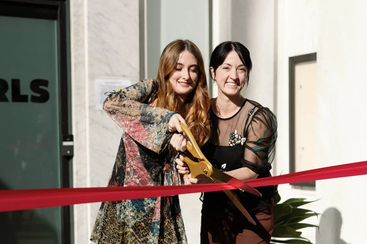 Avery Colvert and her mom, Lauren Sandidge, Altadena Girls co-founder and president, at the opening of the Altadena Girls community center. In just over a year, Altadena Girls has provided over 1.2 million essential items and served 3,500 girls and their families.

