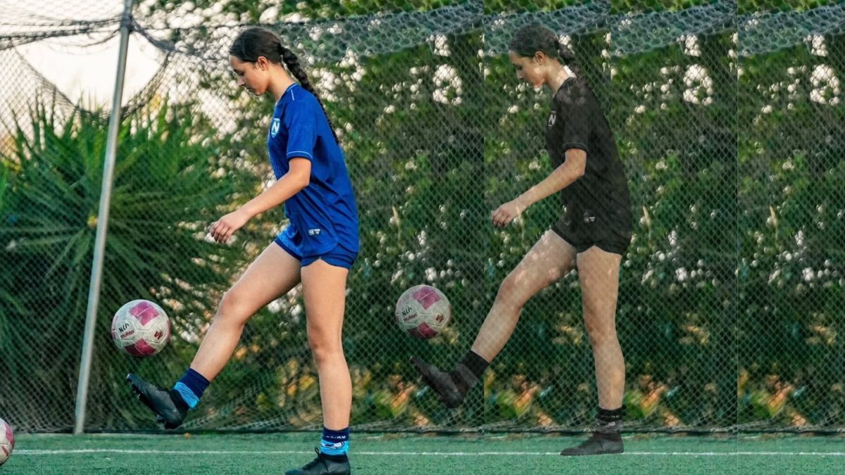 Kasandra dribbling a soccer ball while in Nicaragua.