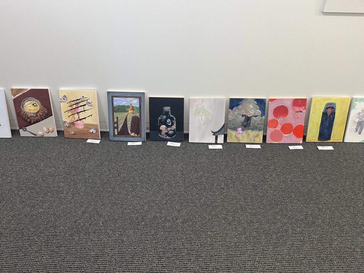 The Painting and Drawing I class's pieces prepared for installation.