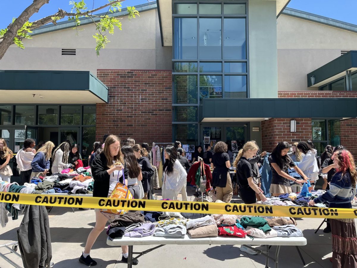 Students sift through clothes at the annual Earth Week clothing swap