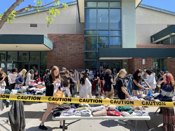 Students sift through clothes at the annual Earth Week clothing swap
